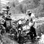 8. SSDT 1957. Loch Eilde Path, Harry Louis the Editor of "the Motor Cycle"  with 650 Triumph on which he was following the trial. He had just fallen off - but what a big bike to attempt such a section !